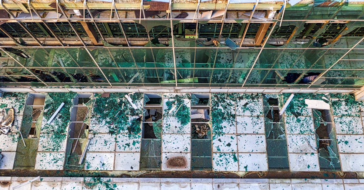 Aerial shot of a dilapidated building with broken glass and visible decay in Banten, Indonesia.