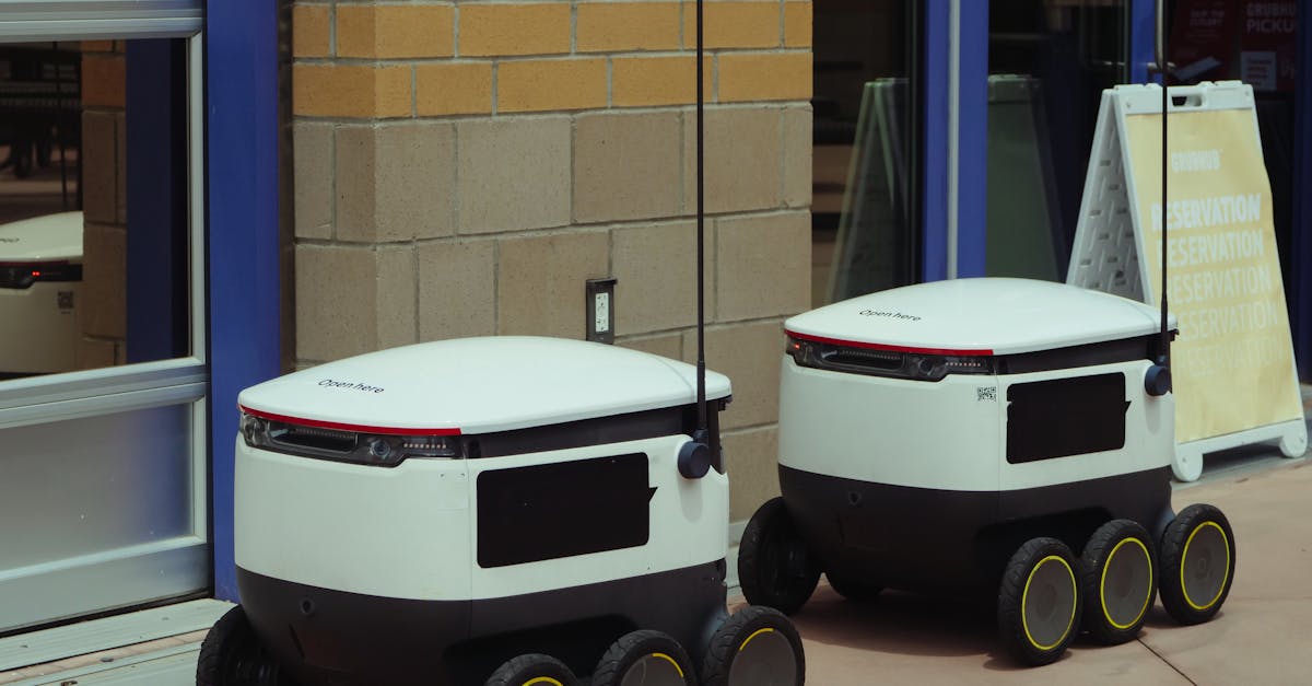 Autonomous delivery robots outside building ready for modern food service.
