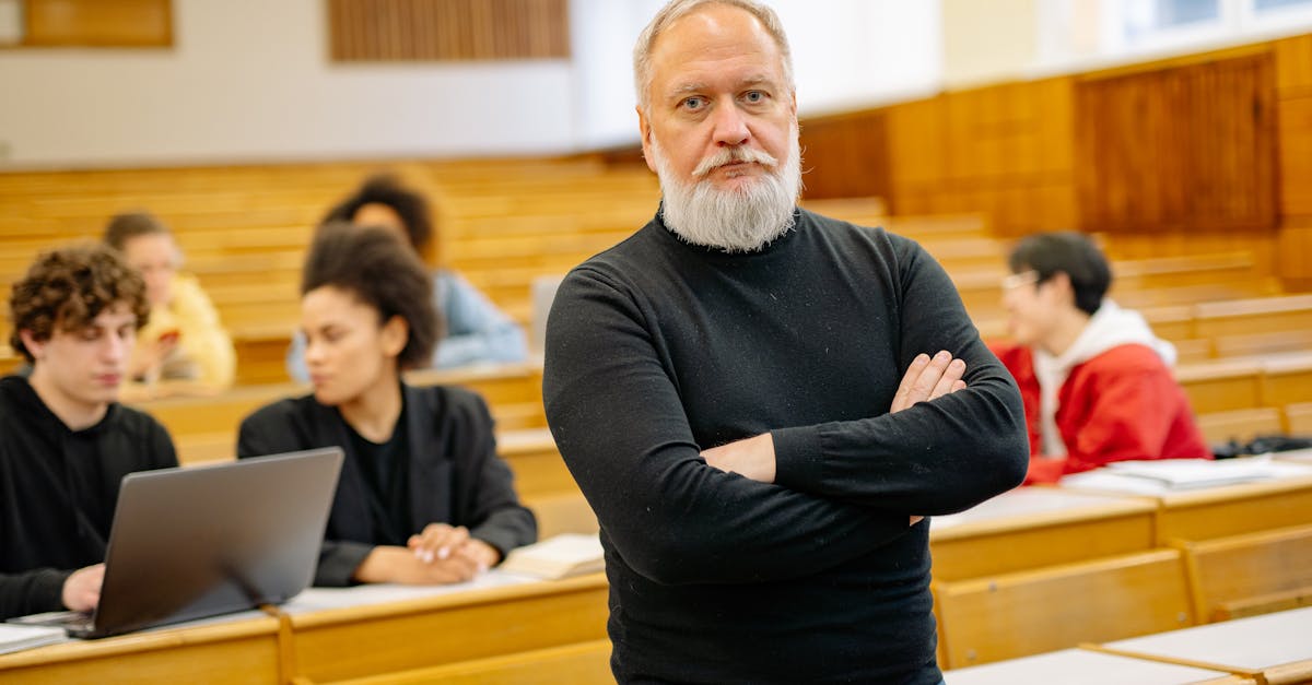 Confident professor in lecture hall with diverse students engaged in learning.