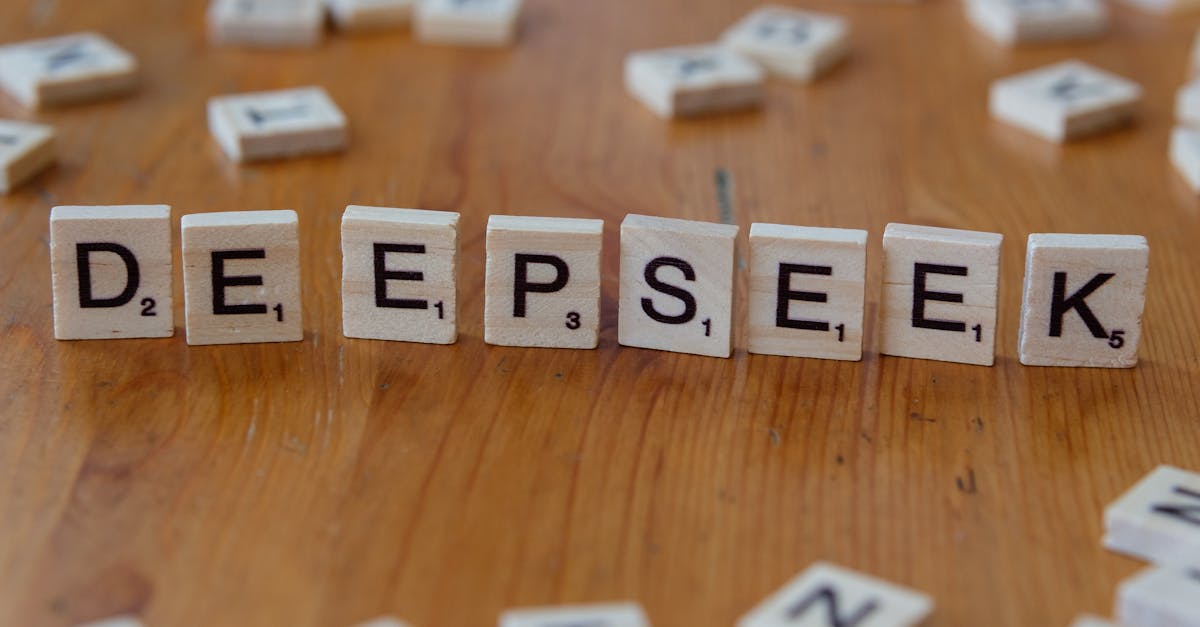 Scrabble tiles spelling 'DeepSeek' on a wooden surface. Perfect for AI and tech themes.