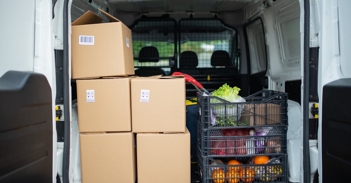 Packed delivery van with boxes and fresh produce crates for efficient logistics.