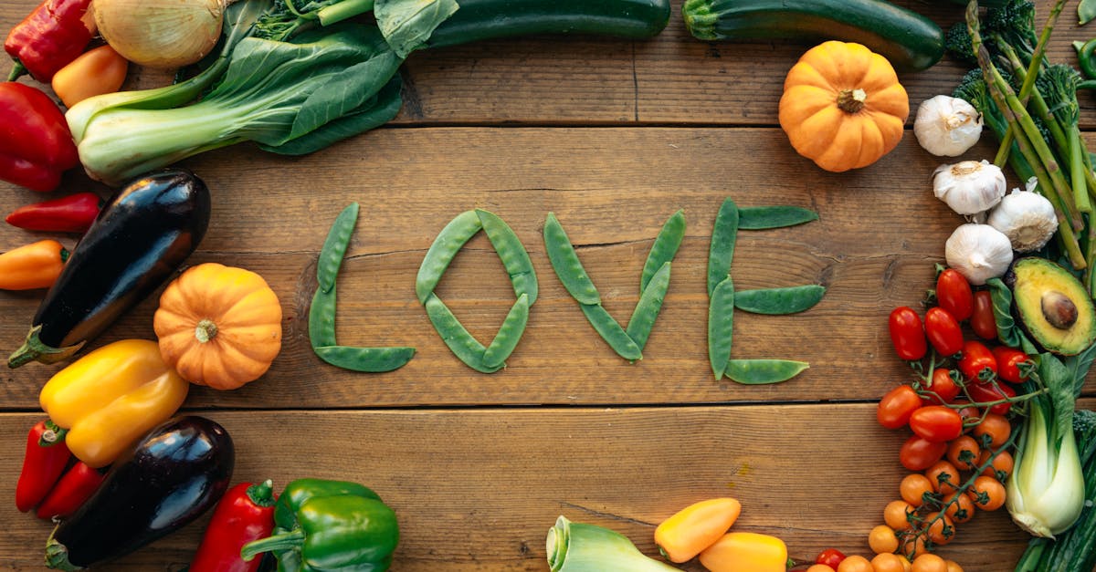 A vibrant display of assorted vegetables forming the word love, symbolizing healthy eating.