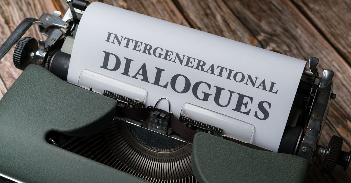 Close-up of a vintage typewriter with paper reading 'Intergenerational Dialogues'.
