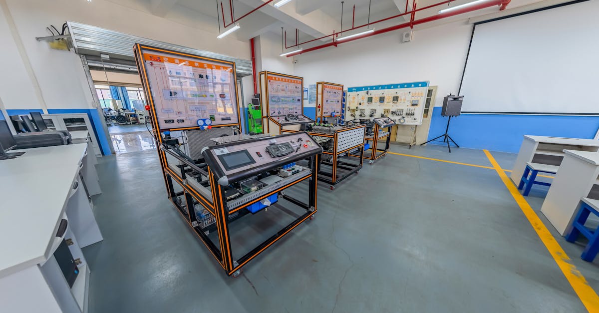Spacious engineering laboratory equipped with advanced training systems and desks.