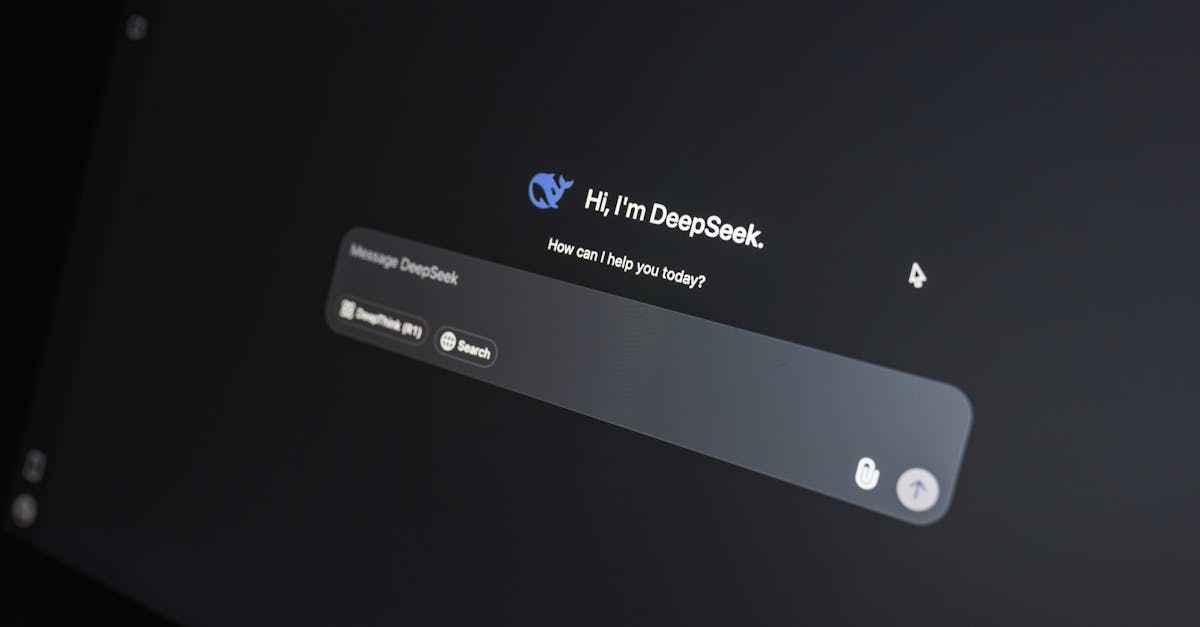 Close-up of DeepSeek AI chat interface on a laptop screen in low light.