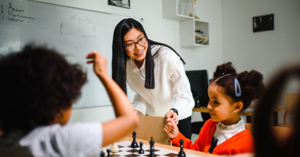 Engaging classroom scene with teacher guiding children in a chess game, fostering learning and fun.