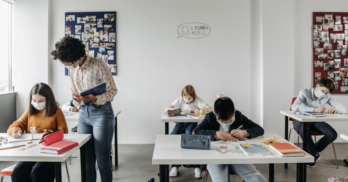 Students and teacher in masks in a classroom setting post-pandemic, focusing on safe learning.