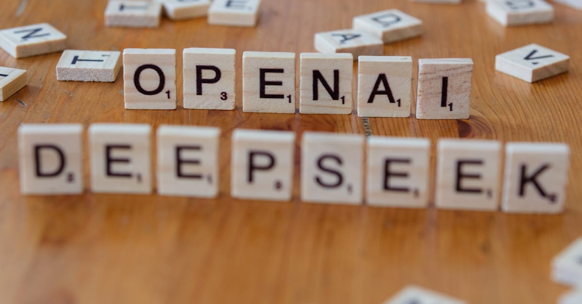 Close-up of wooden Scrabble tiles spelling OpenAI and DeepSeek on wooden table.