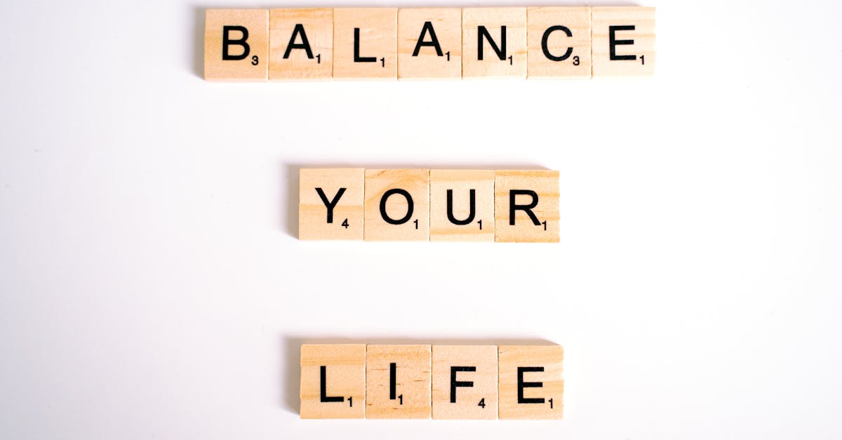 Inspirational message 'Balance Your Life' made with Scrabble tiles on a white background.