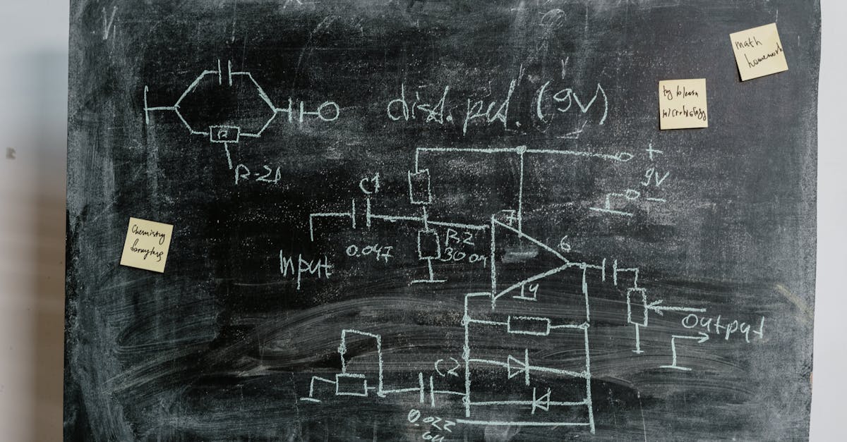 A detailed circuit diagram on a chalkboard with sticky notes, ideal for educational and academic themes.
