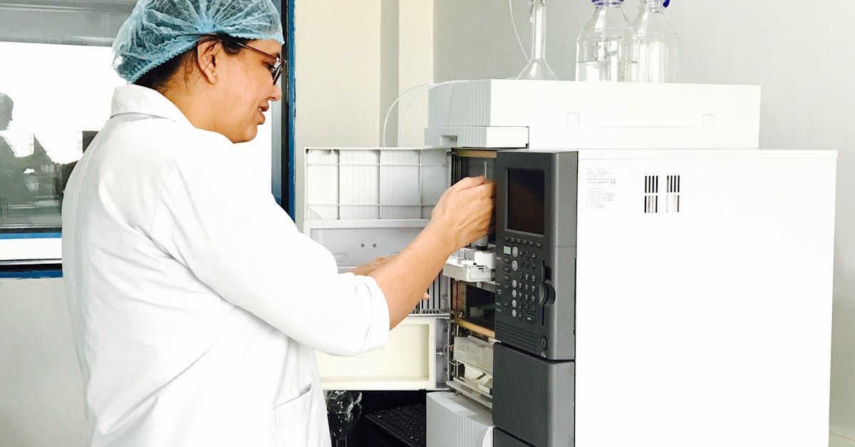 Female scientist using advanced analytical chemistry equipment in a laboratory.