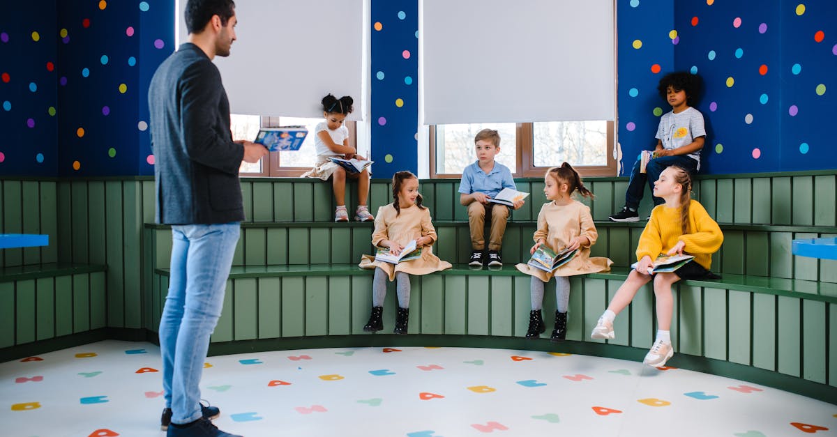 A teacher engaging with young students in a vibrant and playful classroom environment.