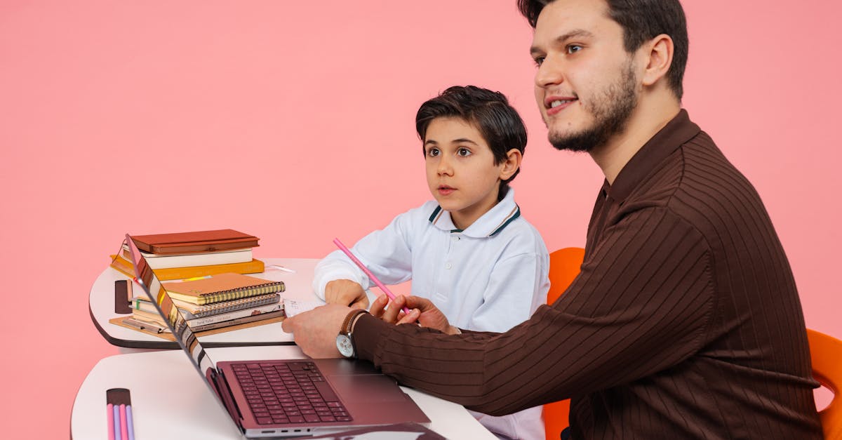 Male teacher and young boy studying together at a desk in Yalova, Türkiye.