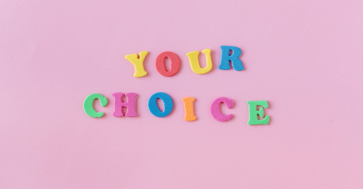 Vibrant foam letters spelling 'YOUR CHOICE' on a pink background. Perfect for concepts of decision-making.