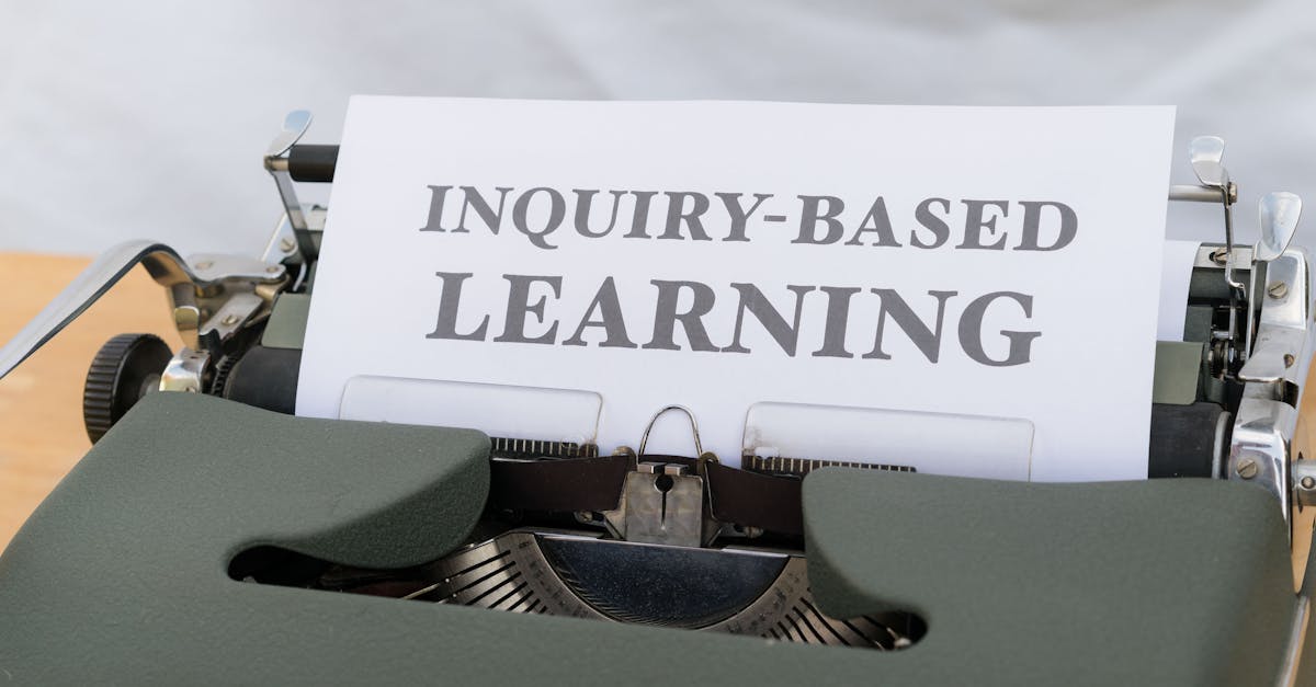 Vintage typewriter displaying 'Inquiry-Based Learning.'